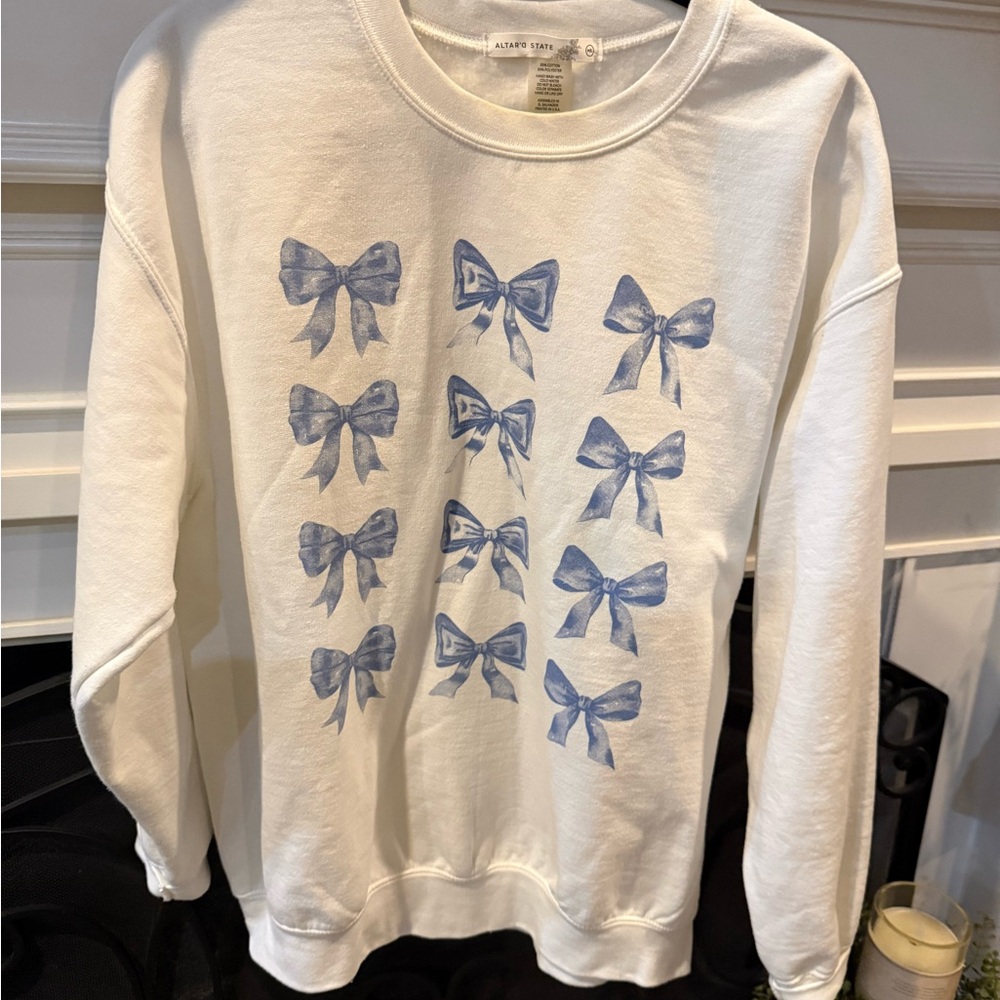 Altar'd State White Sweater with Blue Bow Pattern